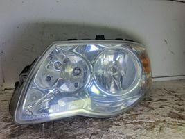 Chrysler Voyager Lampa przednia 084331105L