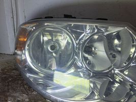 Chrysler Voyager Lampa przednia 04857830AC