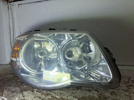 Chrysler Voyager Lampa przednia 04857830AC