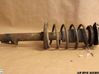 Front shock absorber with coil spring 