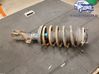 Front shock absorber with coil spring 
