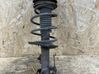 Front shock absorber with coil spring 