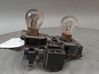 Tail light bulb cover holder 