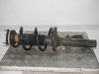 Front shock absorber with coil spring 