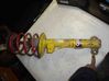 Front shock absorber with coil spring 