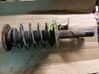 Front shock absorber with coil spring 