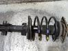 Front shock absorber with coil spring 