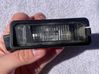 Lampa oświetlenia tylnej tablicy rejestracyjnej 1K8943021