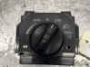 Ajovalojen korkeuden säätökytkin 
