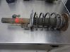 Front shock absorber with coil spring 
