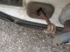 Front door check strap stopper 