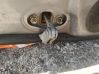 Front door check strap stopper 