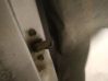 Front door check strap stopper 