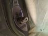 Front door check strap stopper 