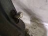 Front door check strap stopper 