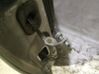 Front door check strap stopper 