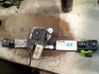 Rear window lifting mechanism without motor 