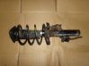 Front shock absorber with coil spring 