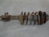 Front shock absorber with coil spring 