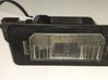 Lampa oświetlenia tylnej tablicy rejestracyjnej 7176934