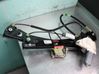 Regulador de puerta delantera con motor 