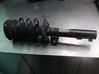 Front shock absorber with coil spring 