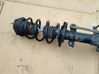Front shock absorber with coil spring 