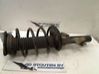 Front shock absorber with coil spring 