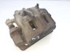 Caliper de freno delantero 4811008B50