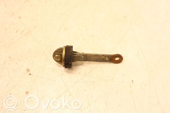 Front door check strap stopper