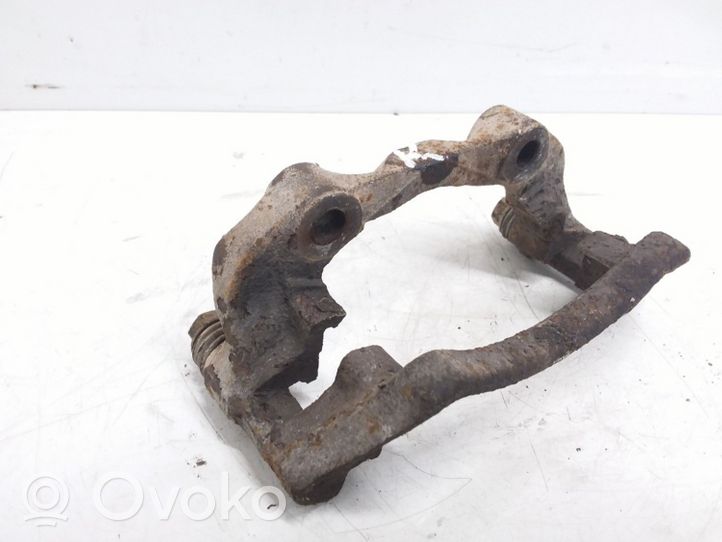 Volkswagen PASSAT B4 Plaquette / support d'étrier avant 