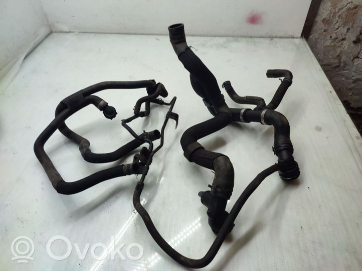 Volkswagen Touran II Engine coolant pipe/hose 1K0121049