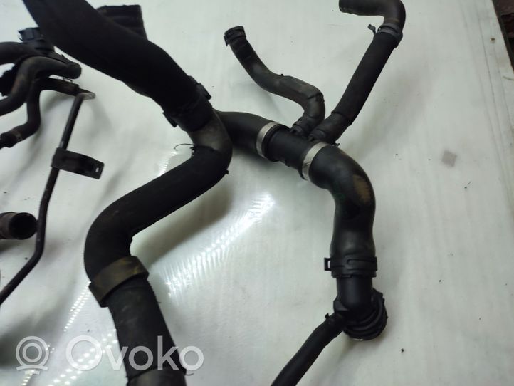 Volkswagen Touran II Engine coolant pipe/hose 1K0121049