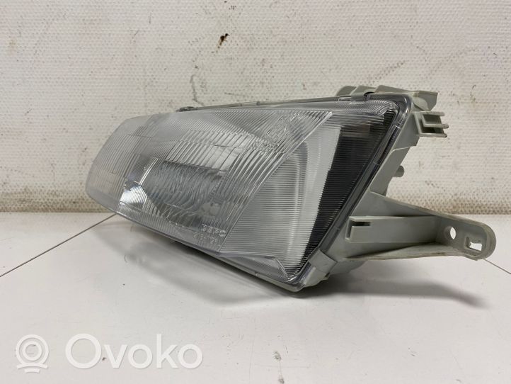 Mazda 323 Lampa przednia 082161126M