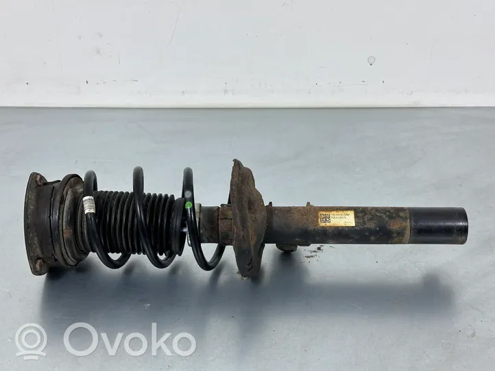 Volkswagen Golf VII Front shock absorber with coil spring 5Q0413023FK