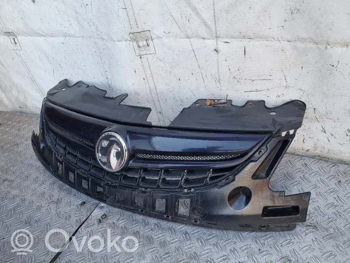 Opel Corsa D Front bumper upper radiator grill 13286000