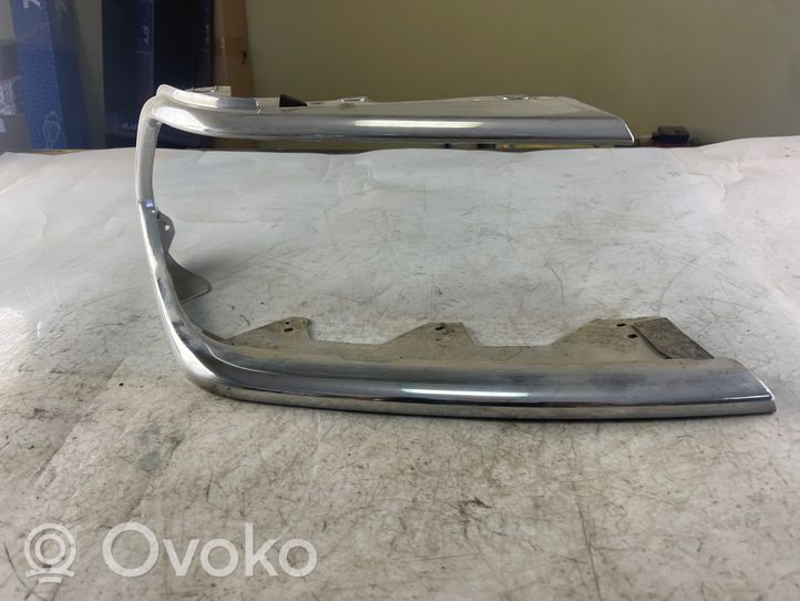 Mitsubishi Pajero Sport I Rivestimento sotto il faro/fanale 10087415