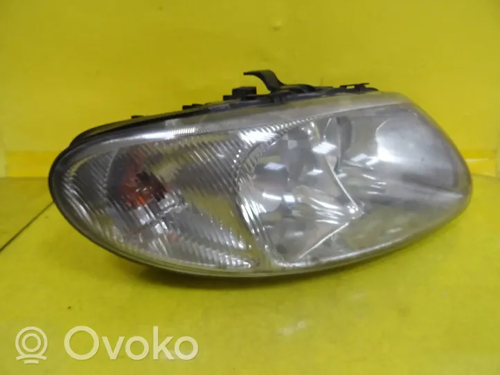 Chrysler Voyager Lampa przednia 04857702AB