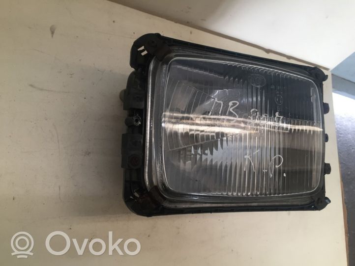 Mercedes-Benz 207 310 Lampa przednia 12130100