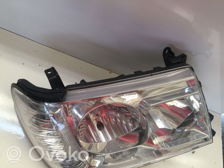 Toyota Land Cruiser (J120) Lampa przednia 8113060A90