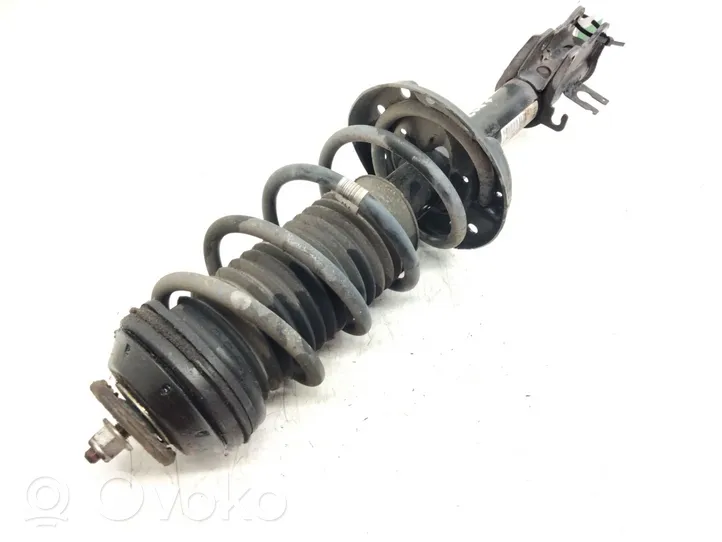 Opel Corsa D Front shock absorber with coil spring 13399043