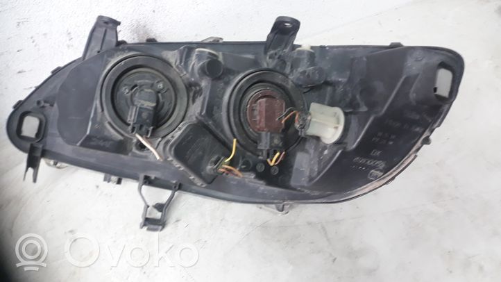 Opel Zafira A Lampa przednia 89100055