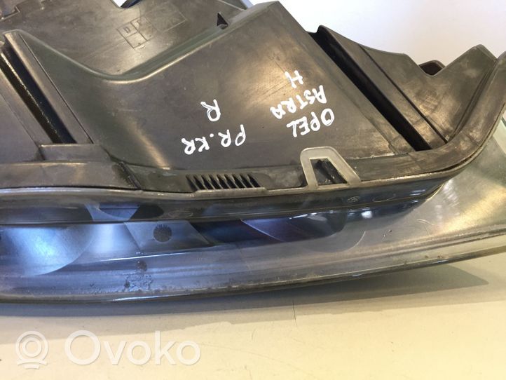 Opel Astra H Lampa przednia 1EG27037001