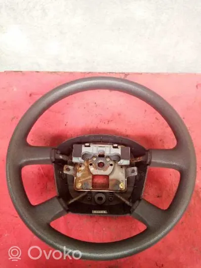 KIA Carens I Steering wheel 0K2FB32980