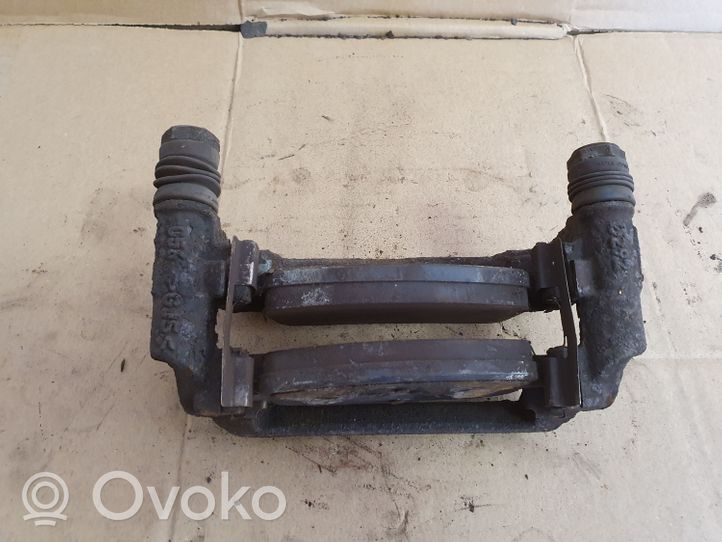 Opel Astra J Supporto della pinza del freno posteriore 