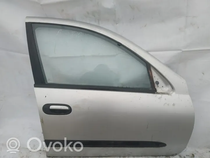 Nissan Almera N16 Drzwi przednie pilka