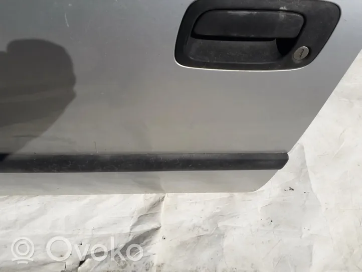 Opel Astra G Rivestimento della portiera anteriore (modanatura) 