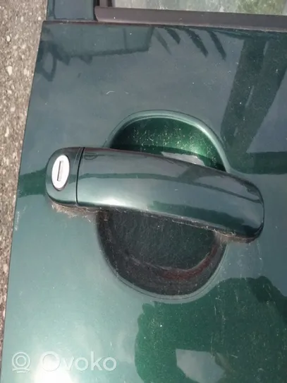 Opel Zafira B Front door exterior handle 