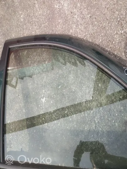 Opel Zafira B Front door window glass four-door 