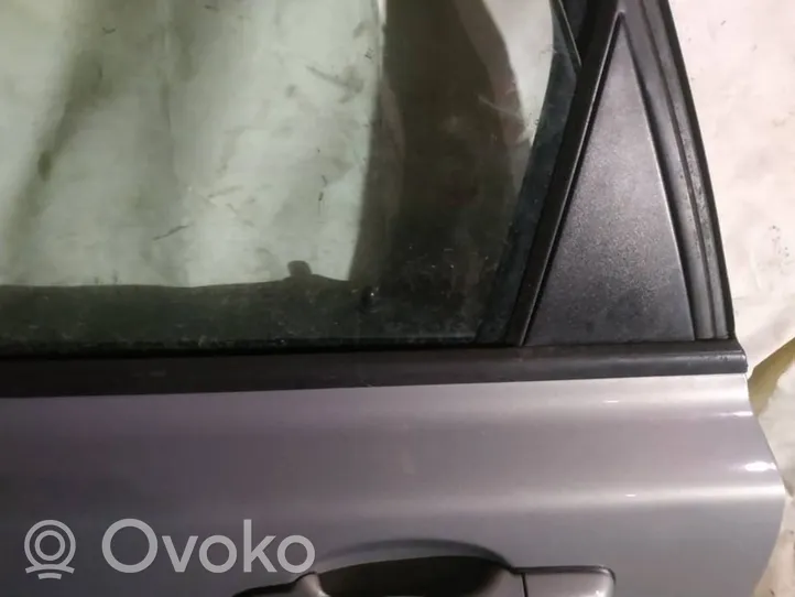 Volvo V50 Aizmugurē durvju stikla apdare 